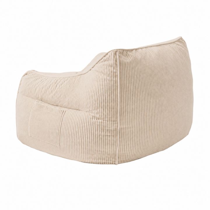Pouf fauteuil en velours côtelé beige, vue trois-quarts