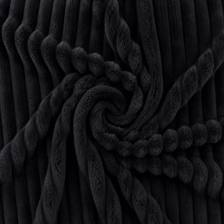 Détail du tissu du pouf poire fourrure côtelée, texture moelleuse et relief côtelé.