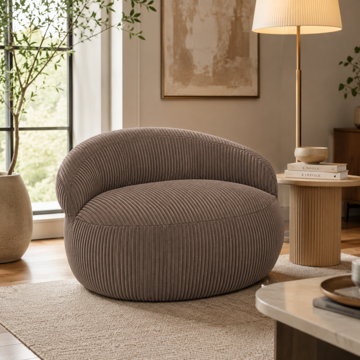 Pouf XXL déhoussable en velours côtelé, forme arrondie, dans un salon