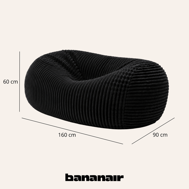 Pouf long géant déhoussable en fourrure côtelée noir, dimensions indiquées 160x90x60 cm