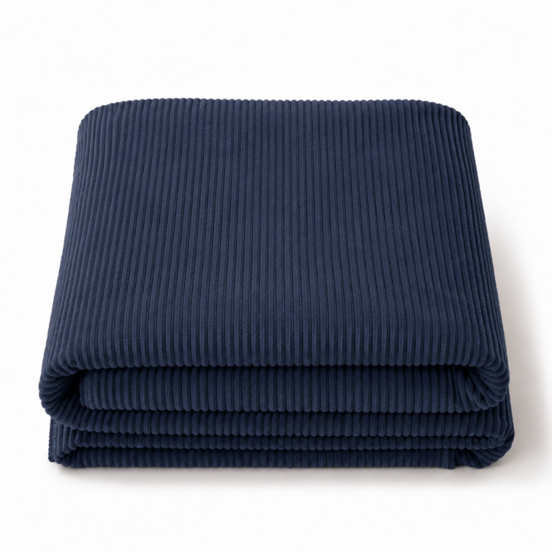 Housse de futon 140x190 cm en velours côtelé bleu foncé, pliée