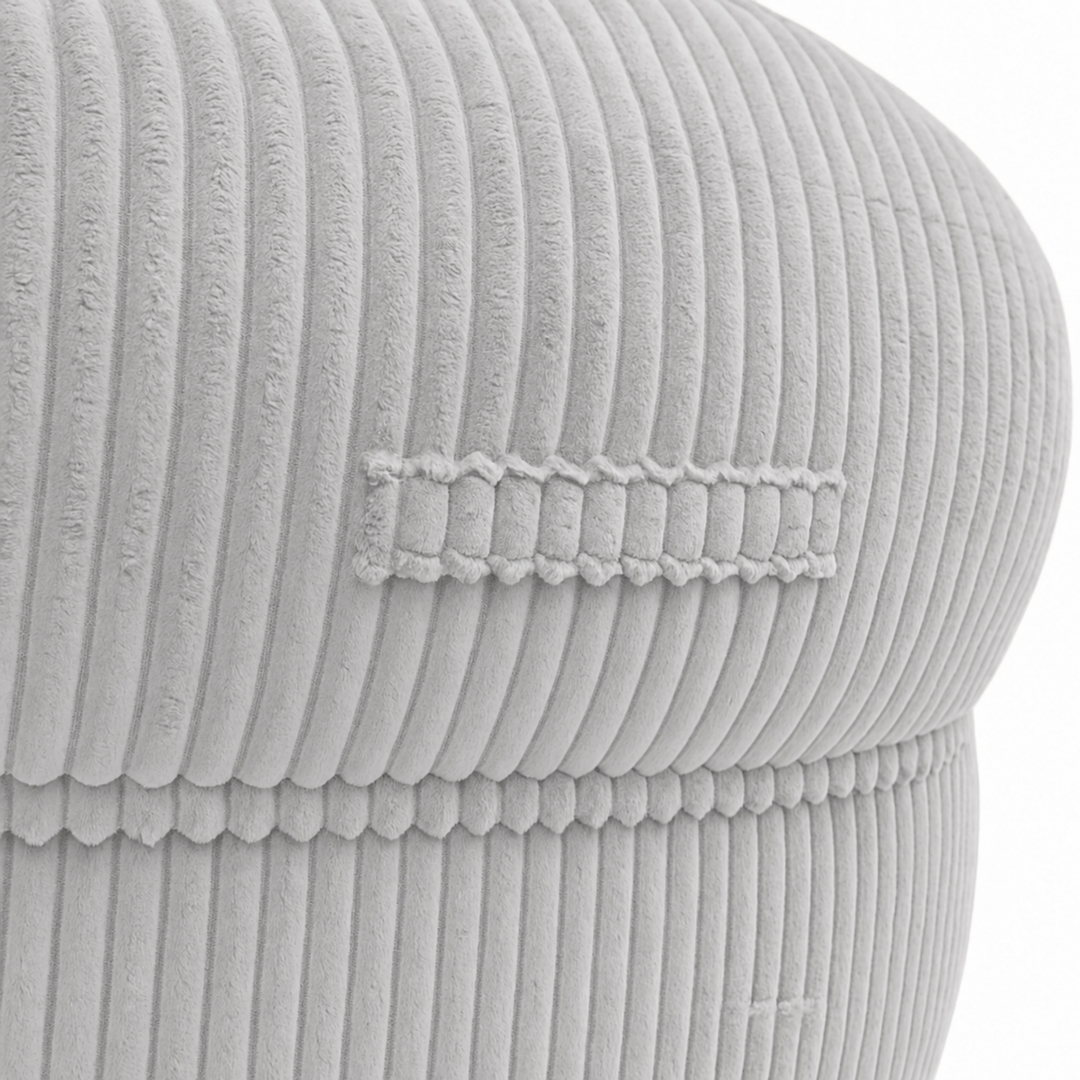 Gros plan sur la poignée du pouf XXL, tissu en velours côtelé.