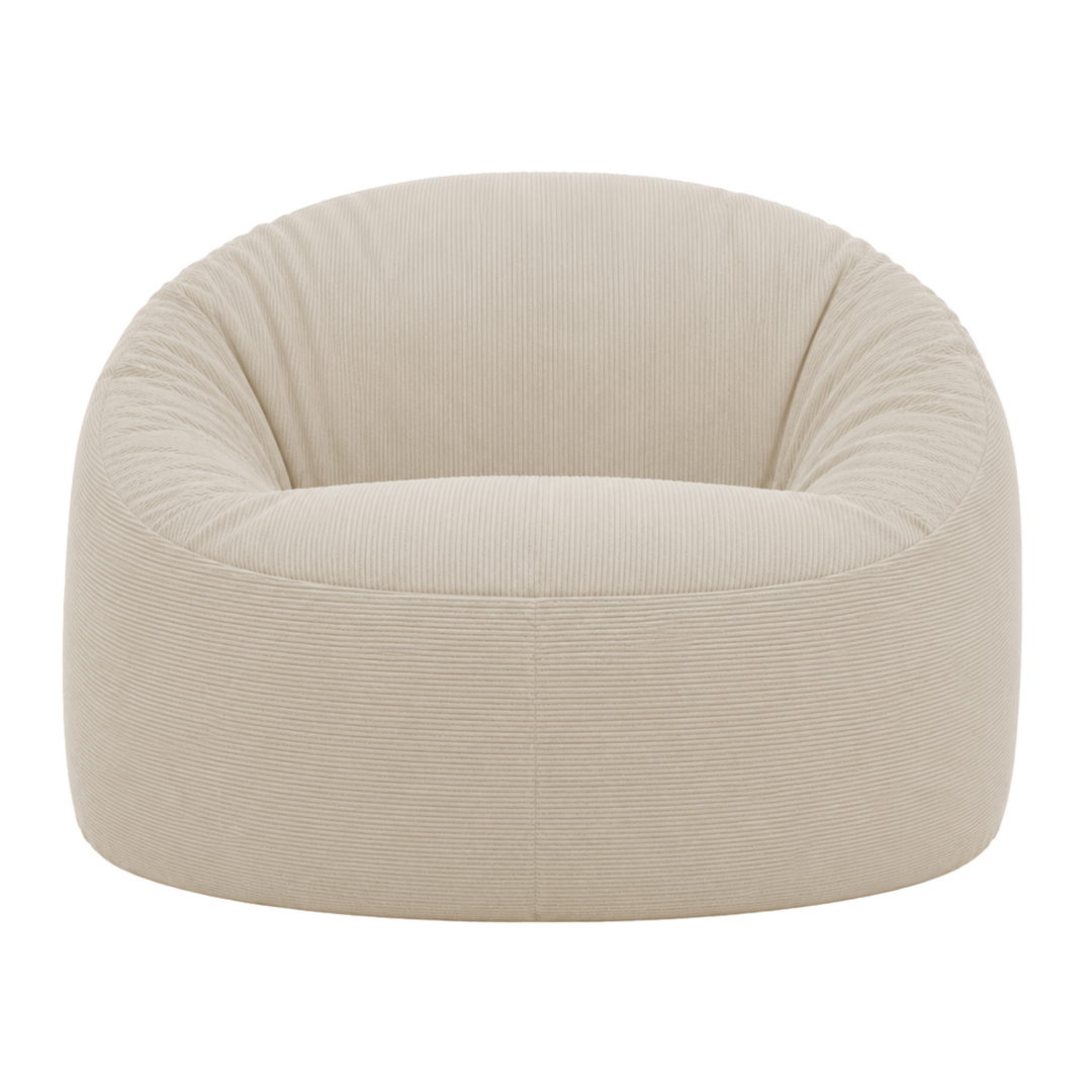 Pouf déhoussable en velours côtelé écru, forme ronde avec texture côtelée visible.