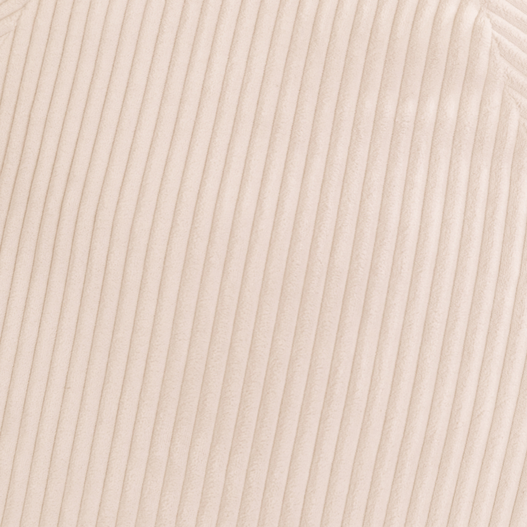 Détail du tissu velours côtelé du pouf poire déhoussable, relief des côtes.