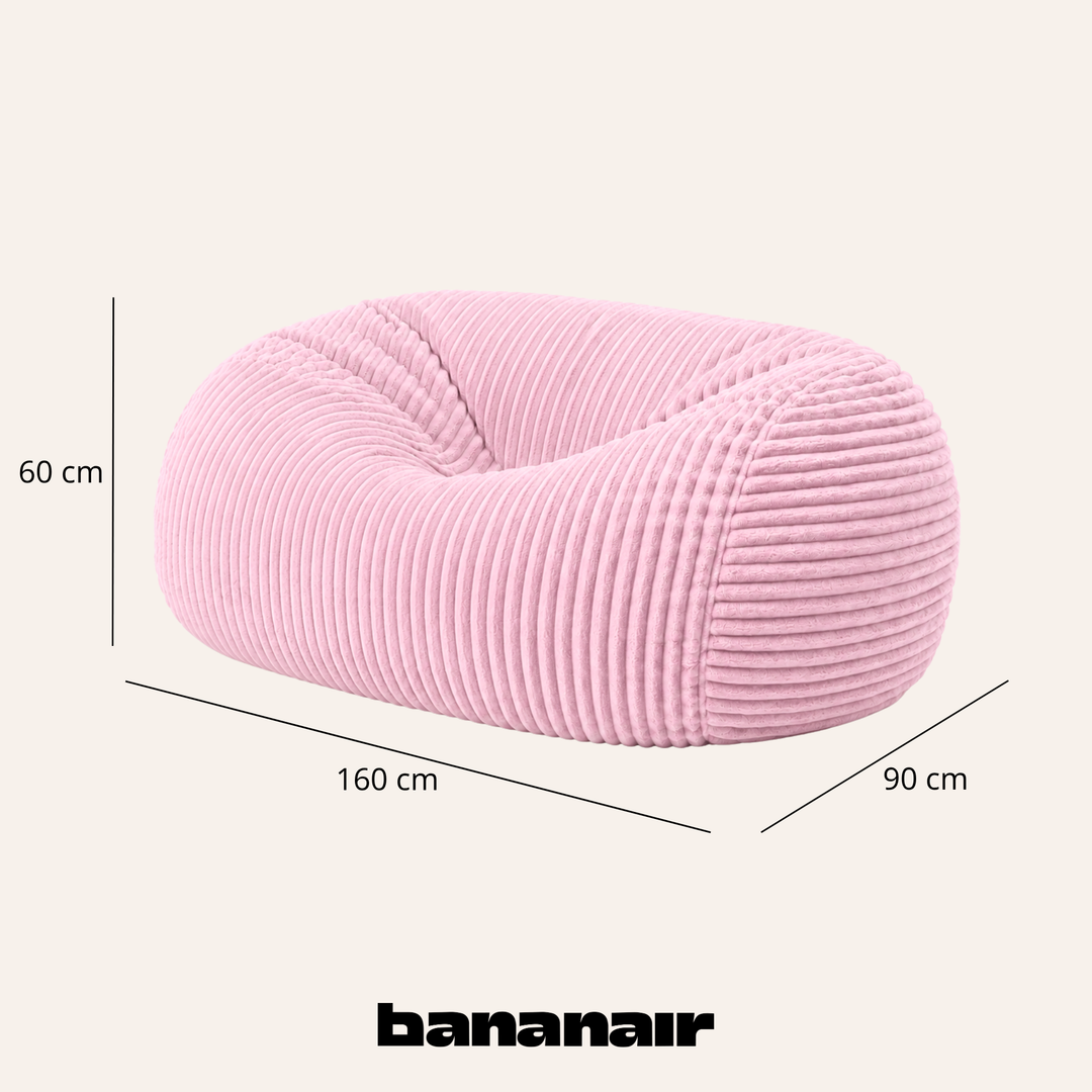 Pouf long géant déhoussable en fourrure côtelée rose, dimensions indiquées 160x90x60 cm