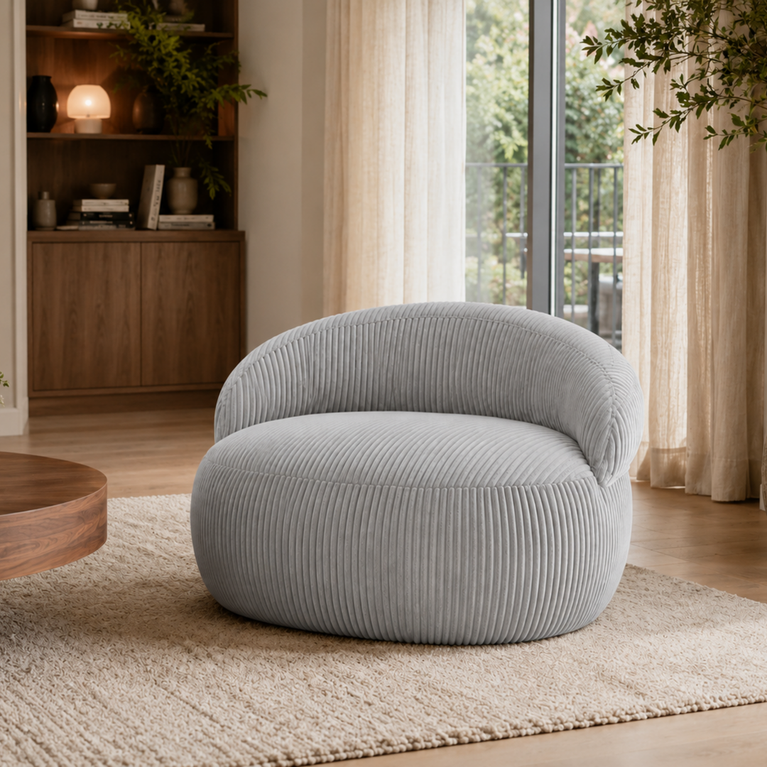 Pouf XXL déhoussable en velours côtelé, forme arrondie, dans un salon